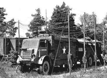 Photographed at Montgomery's Signals H.Q. these vehicles were landed in Normandy during the first...